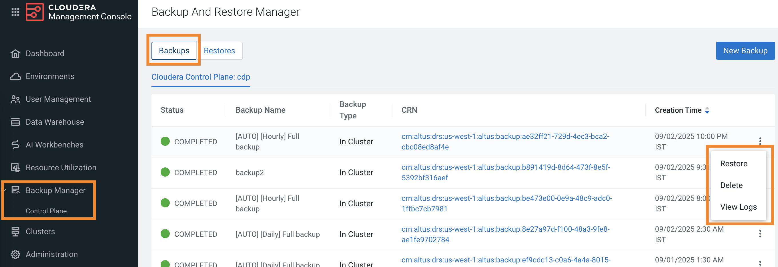 The sample image shows the Backups tab on the Backup and Restore Manager. It shows the backup entity name, list of all backups, the current status of the backup event, the backup name you provided while you initiated the backup, and the timestamp when the backup event started. The Actions menu for each backup event shows Restore, Delete, and View Logs. 
